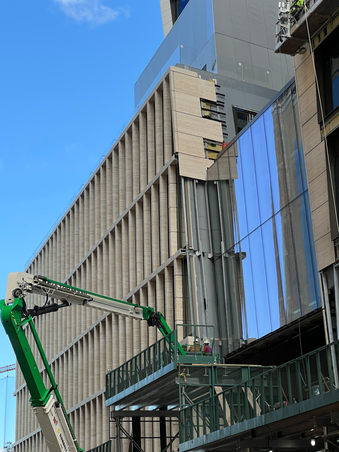 Stone facade and glazing installation in progress at 500 West 18th Street