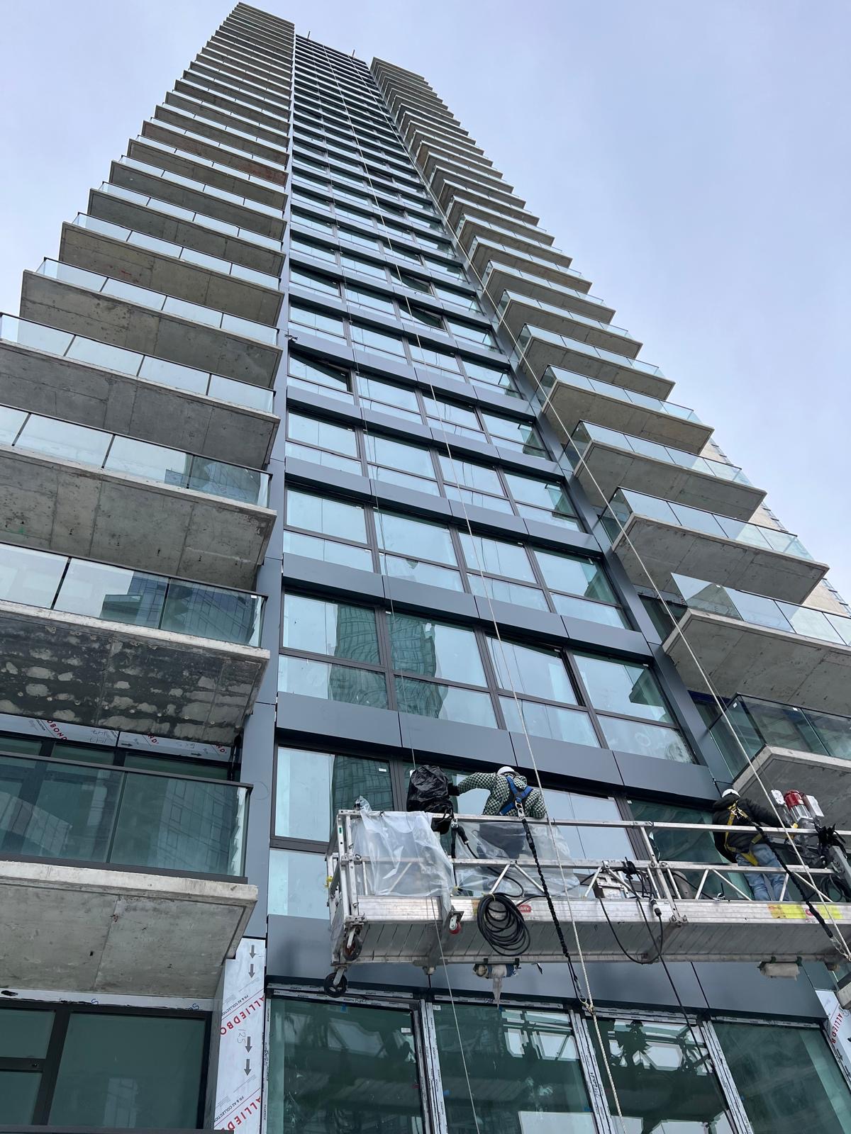 625 Fulton Street facade, balcony and window installation viewed from street level
