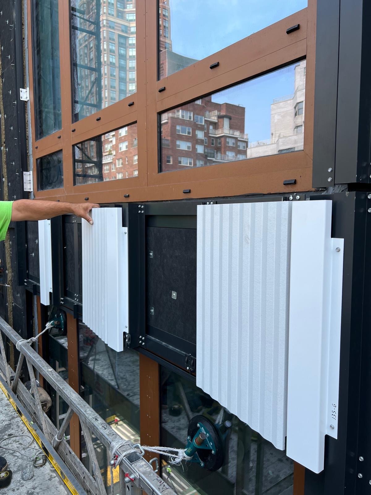 Exterior stone facade panel installation at 1299 3rd Avenue