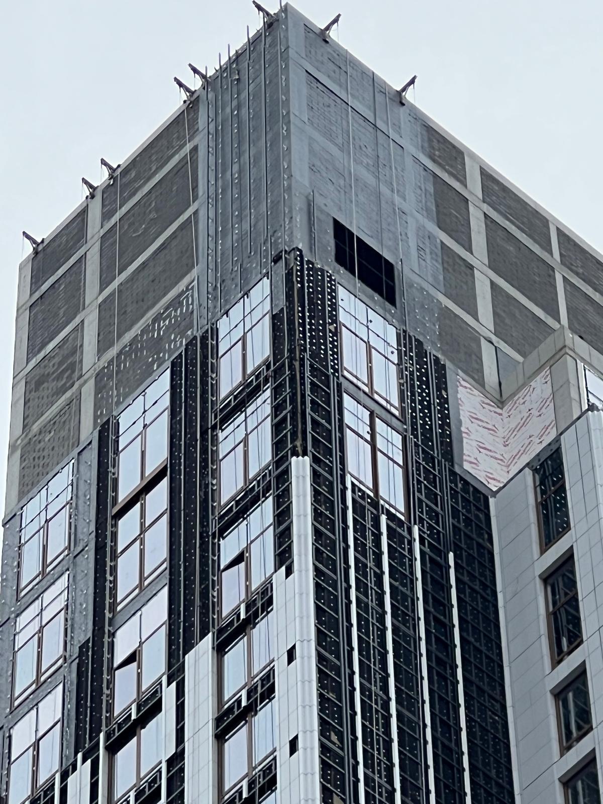 Detailed view of the upper facade installation at 1299 3rd Avenue
