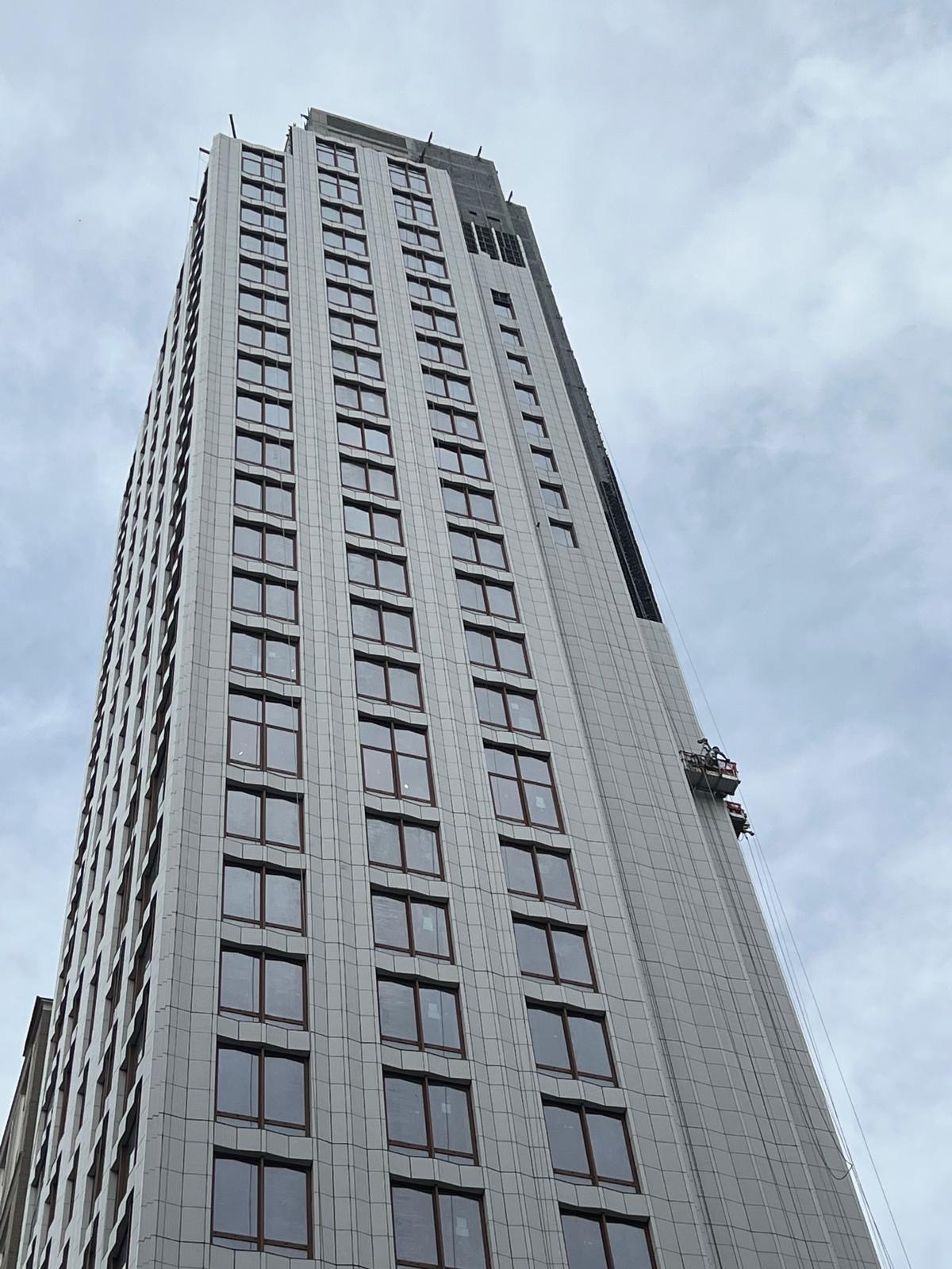 Full-height view of the installed facade and windows at 1299 3rd Avenue