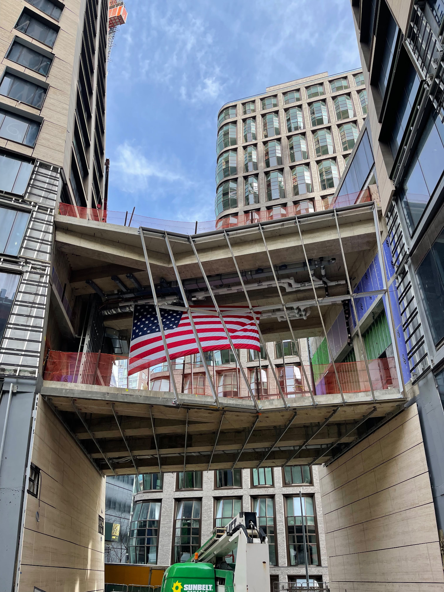 Courtyard facade and bridge construction at 500 West 18th Street