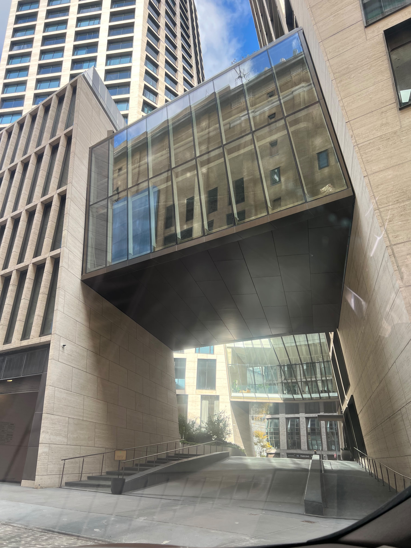 Glass bridge and stone facade at 500 West 18th Street